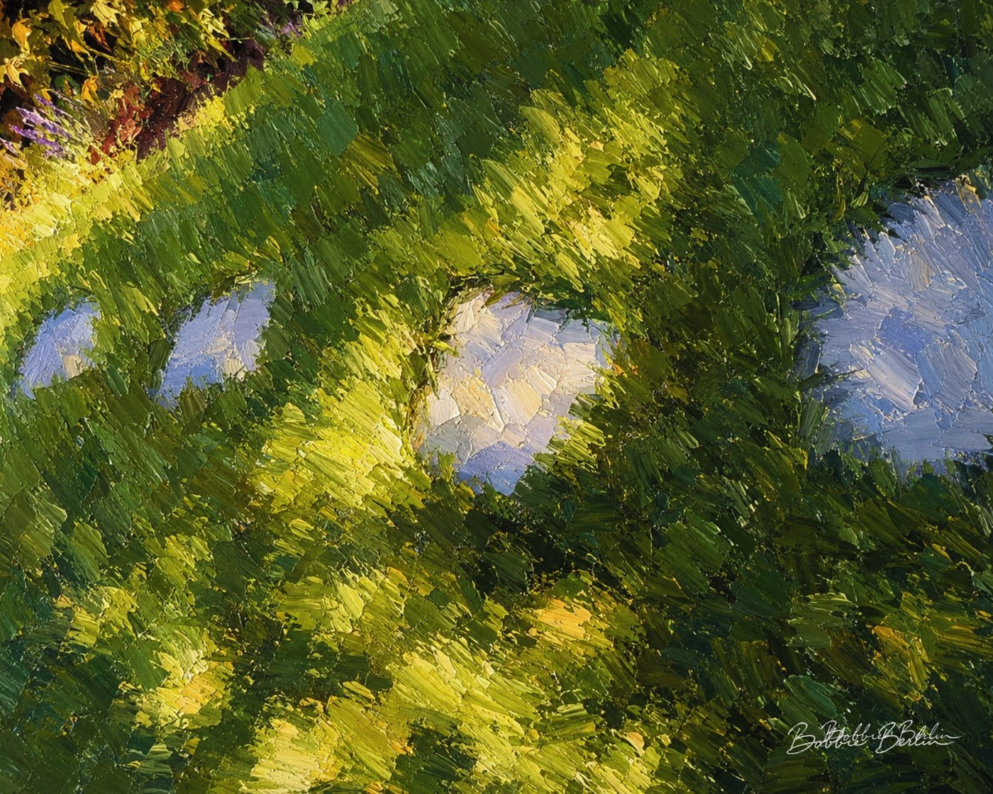 Grey stepping stones cutting through luminous green grass